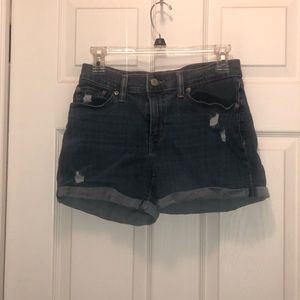 Mid length Levi’s slightly distressed jean shorts